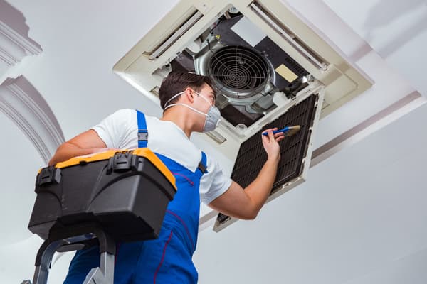 Worker-repairing-ceiling-AC-unit (1)